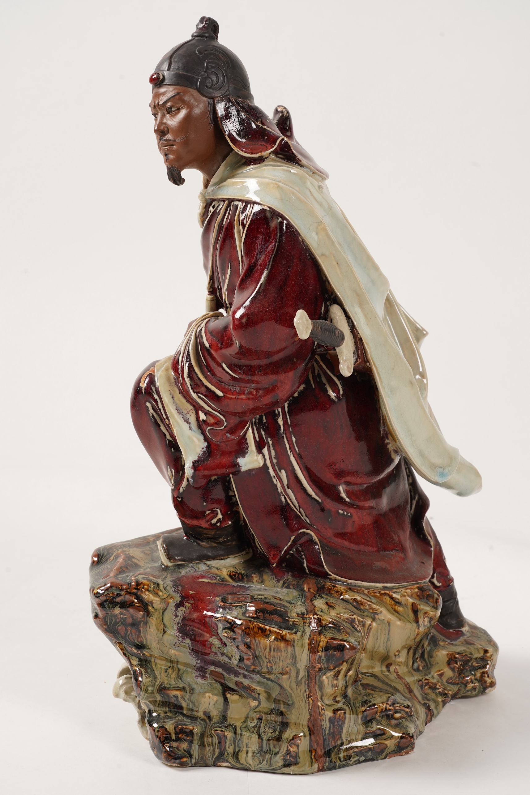 A large Chinese Shiwan stoneware figure of a warrior, 20th century